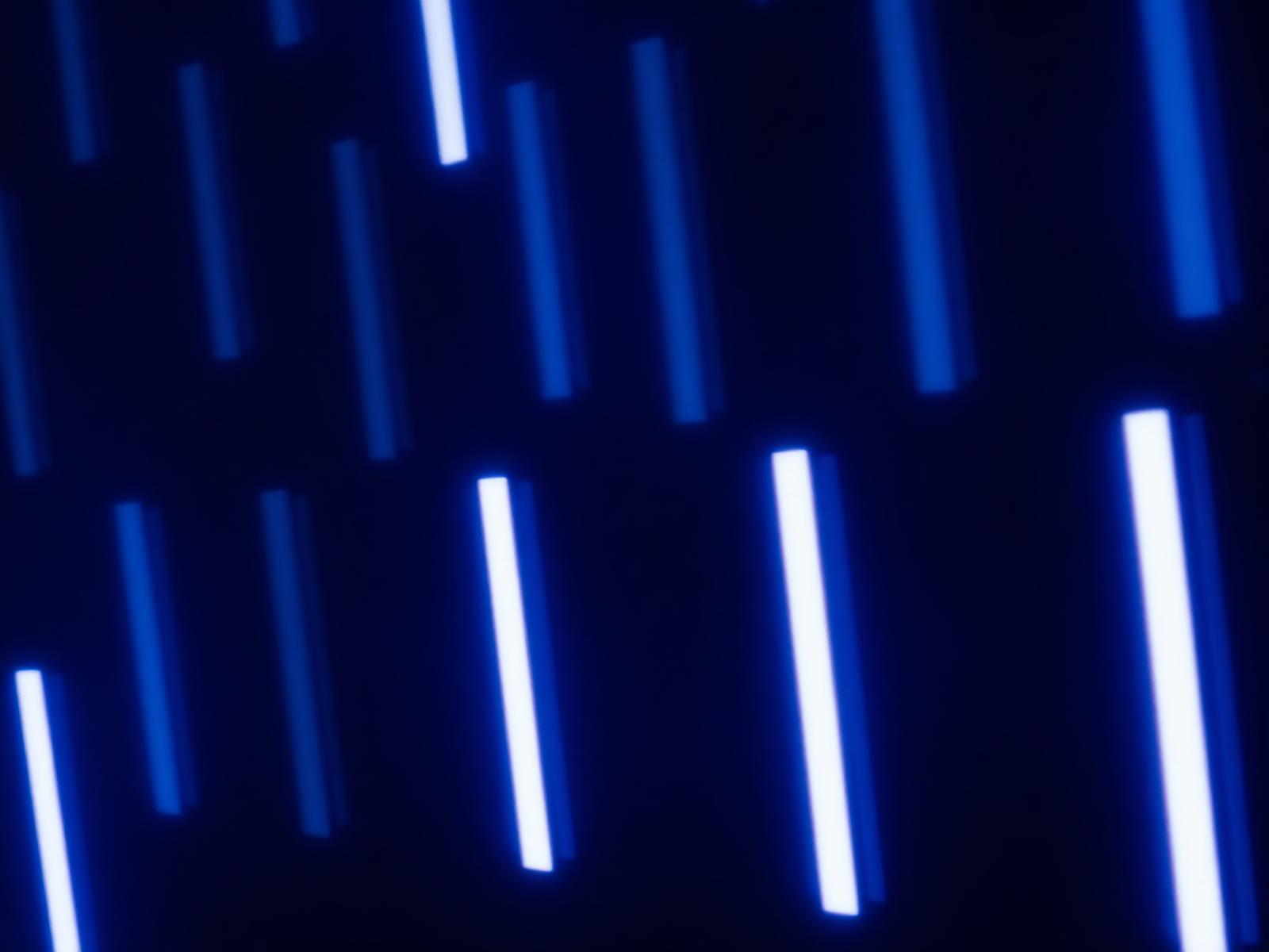 Abstract grid of glowing vertical video frames